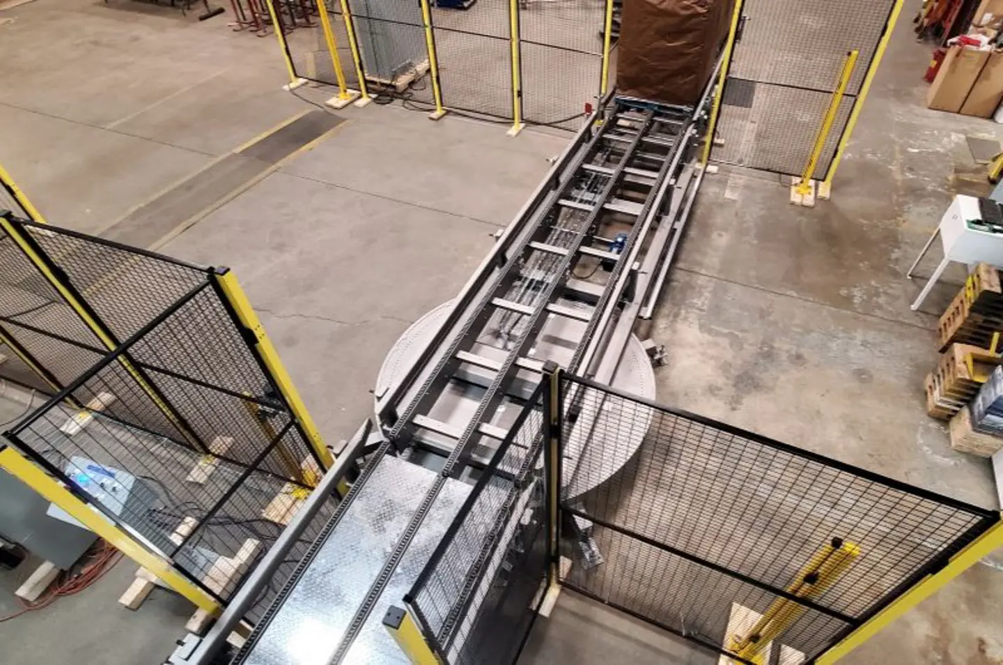 overhead view of conveyors and fencing