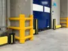 yellow column guards around a upright column and impact protection installed in a dispatch area